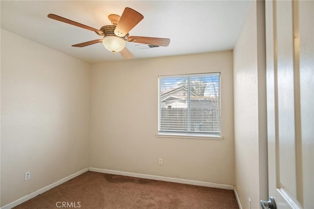 empty room featuring carpet flooring and ceiling fan