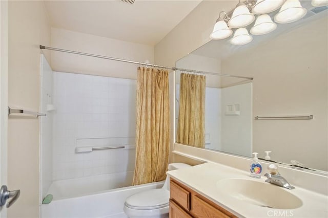 full bathroom featuring vanity, toilet, an inviting chandelier, and shower / bath combo with shower curtain