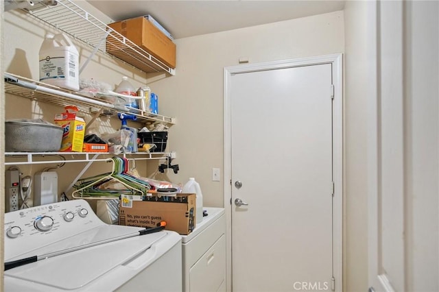 washroom with washer and dryer