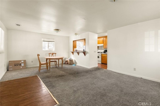 interior space featuring dark colored carpet