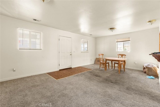 entryway with carpet and plenty of natural light