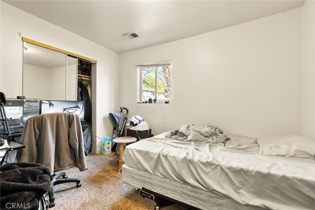 carpeted bedroom featuring a closet