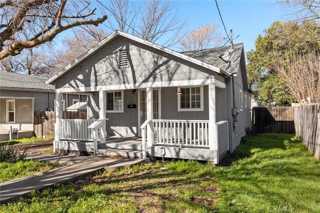 bungalow with a porch and a front yard