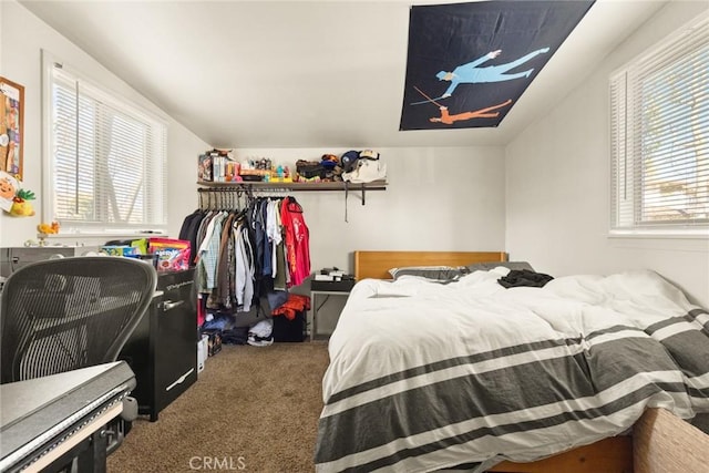 carpeted bedroom with vaulted ceiling