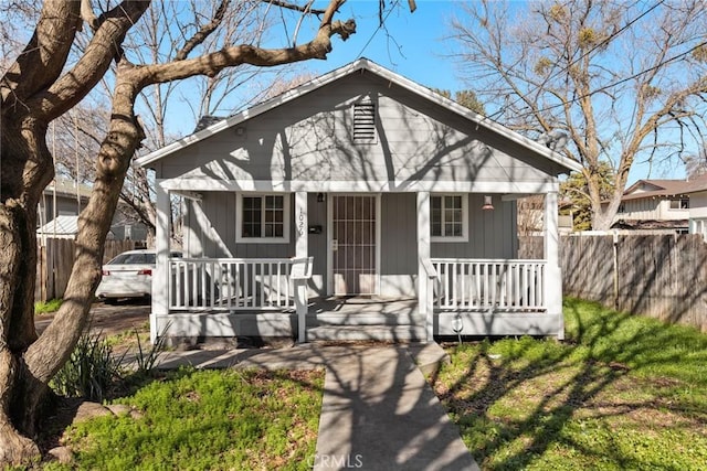 bungalow-style home featuring a front yard and a porch