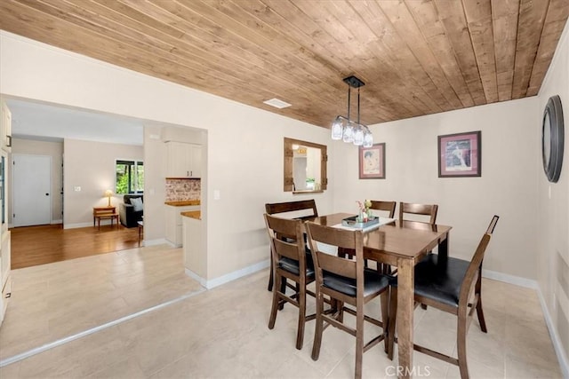 dining space featuring wooden ceiling, visible vents, baseboards, and light tile patterned flooring