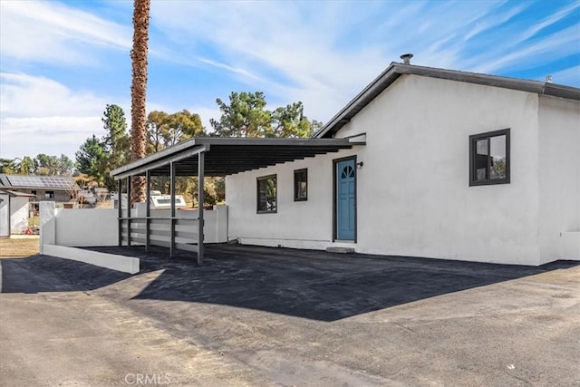 exterior space with stucco siding