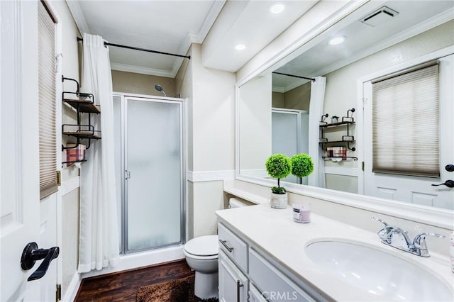 bathroom with a stall shower, visible vents, wood finished floors, and ornamental molding