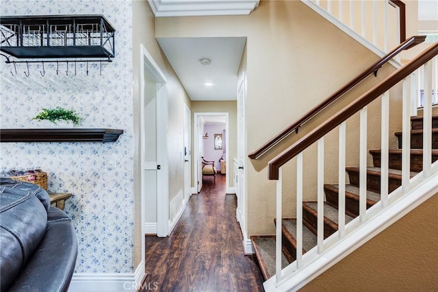 corridor with wallpapered walls, stairs, baseboards, and wood finished floors