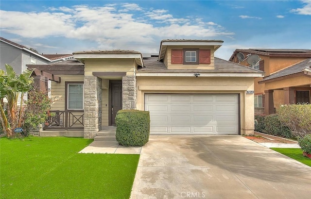 view of front of home featuring a garage and a front yard