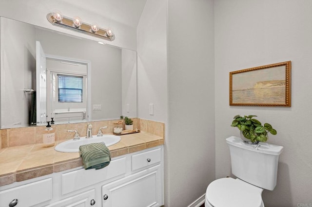 bathroom with toilet and vanity