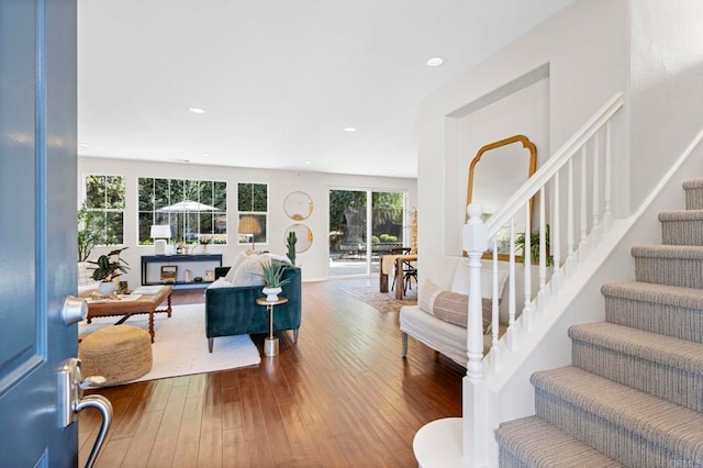 interior space featuring stairs, wood finished floors, and recessed lighting