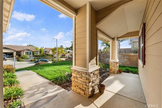 view of patio / terrace featuring covered porch and a residential view