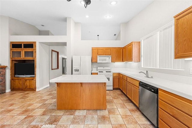 kitchen with white appliances, a high ceiling, a sink, a kitchen island, and light countertops