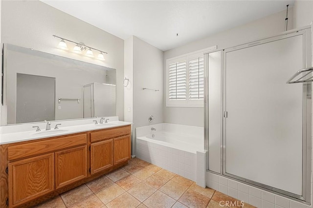 bathroom with double vanity, a sink, and a shower stall