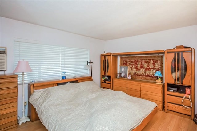 bedroom featuring light wood-type flooring