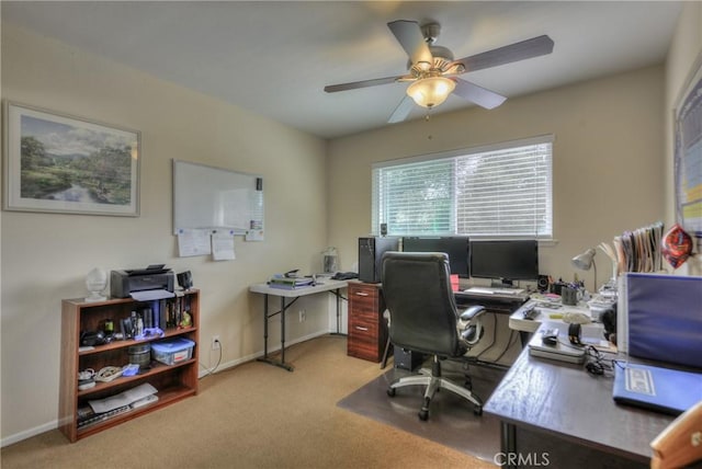 office space with light colored carpet and ceiling fan