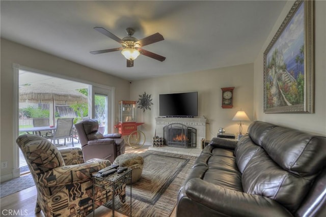 living room with hardwood / wood-style flooring and ceiling fan