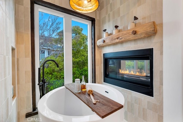 interior space featuring tile walls and a fireplace