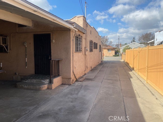 view of property exterior with a patio