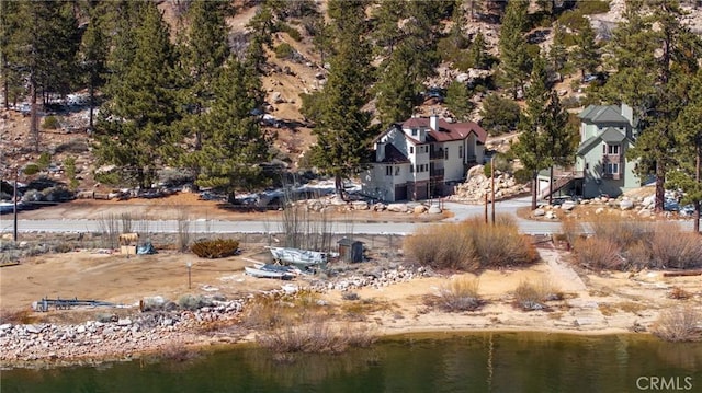 birds eye view of property featuring a water view