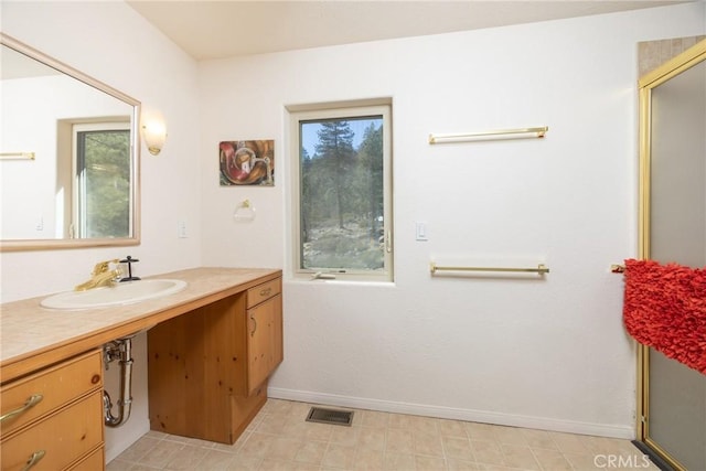 bathroom with visible vents, vanity, and baseboards