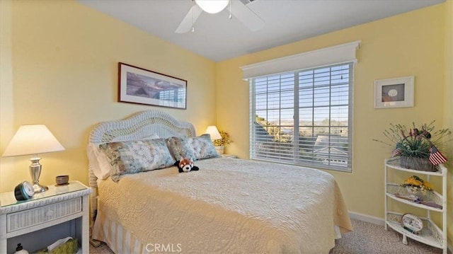 bedroom with ceiling fan and carpet