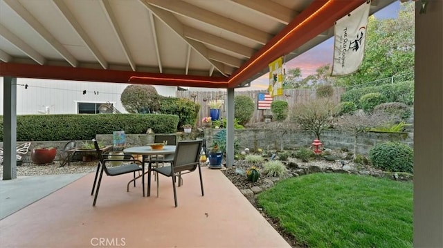 view of patio terrace at dusk