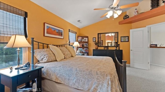 carpeted bedroom featuring lofted ceiling and ceiling fan