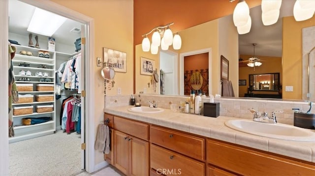 bathroom with vanity and ceiling fan