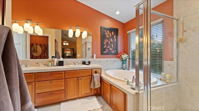 bathroom featuring vaulted ceiling, tile walls, vanity, plus walk in shower, and tile patterned flooring