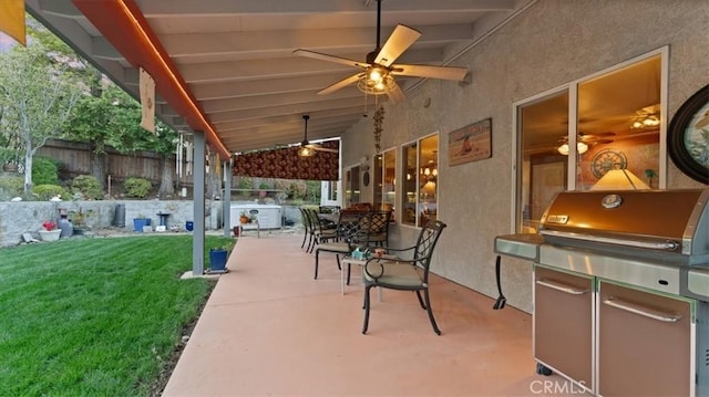 view of patio with a grill and ceiling fan