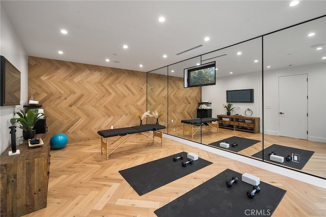 exercise room with light parquet flooring