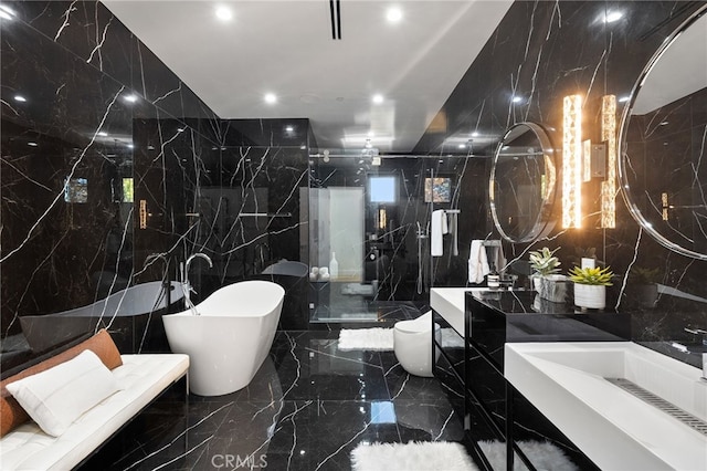 full bathroom featuring toilet, separate shower and tub, sink, and tile walls