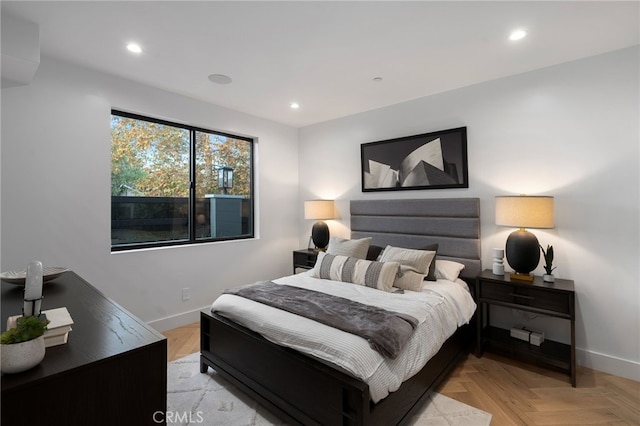 bedroom with light parquet floors