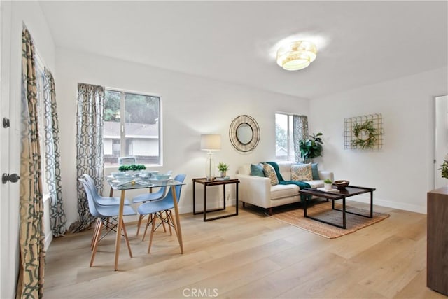 sitting room with light hardwood / wood-style flooring