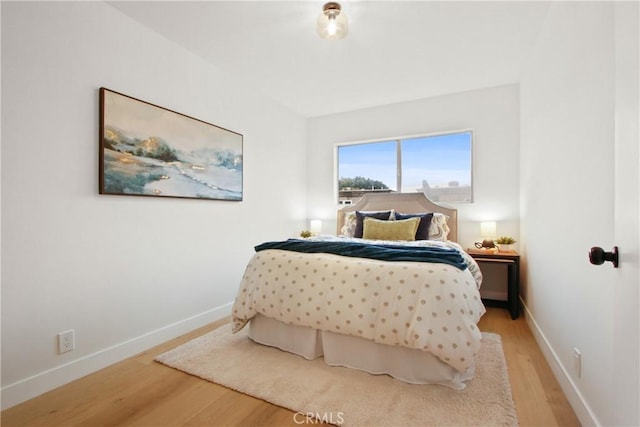 bedroom featuring hardwood / wood-style flooring