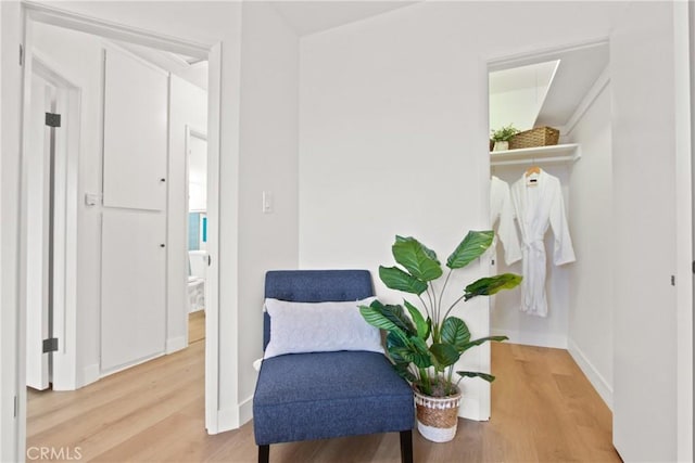 sitting room featuring hardwood / wood-style flooring