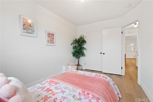 bedroom featuring a closet and light hardwood / wood-style flooring