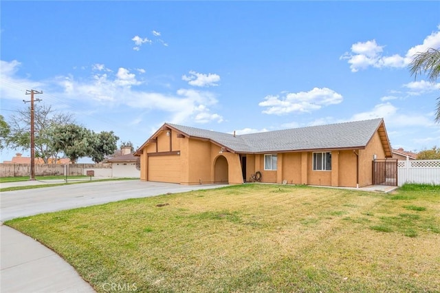 ranch-style house featuring an attached garage, fence, concrete driveway, stucco siding, and a front yard