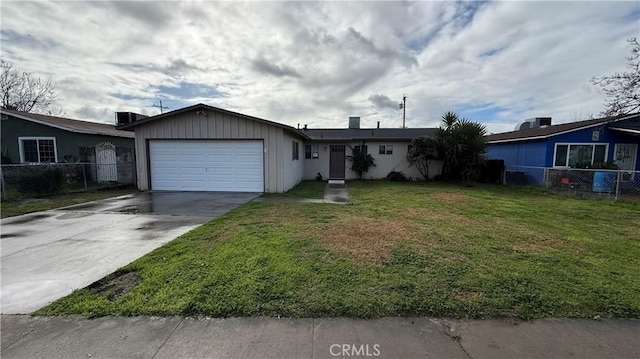 ranch-style home with a garage and a front yard