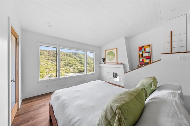 bedroom featuring baseboards and light wood-style floors