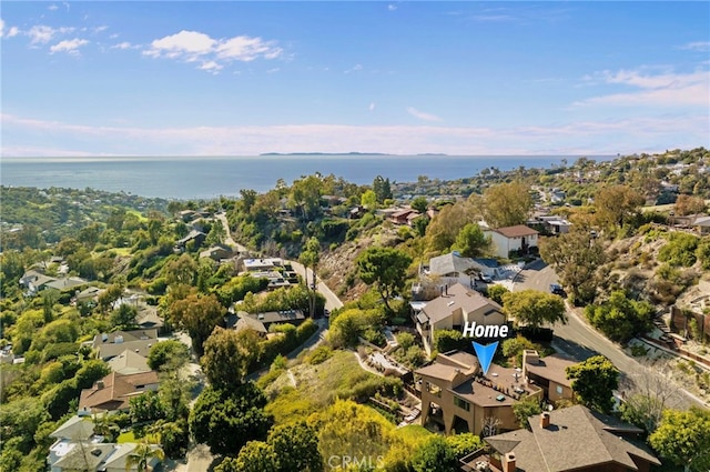 drone / aerial view with a water view and a residential view