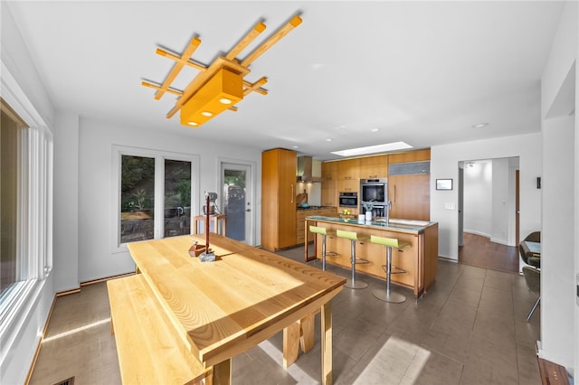 dining space featuring a skylight and recessed lighting