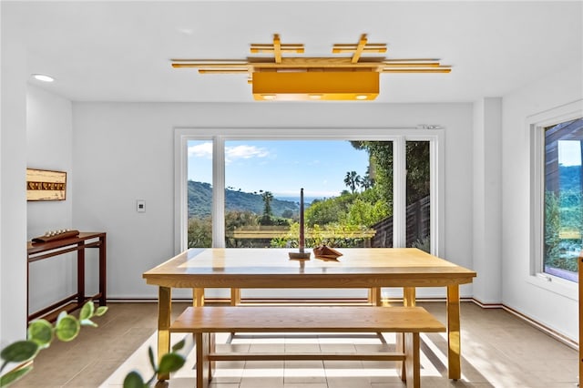 dining room with a mountain view and recessed lighting