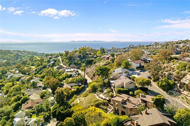 birds eye view of property with a water view and a residential view