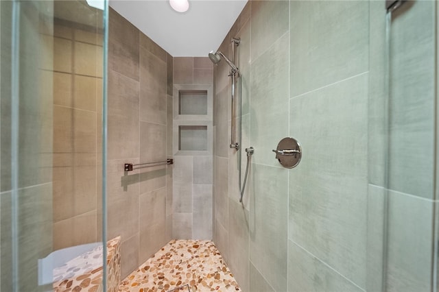 full bathroom featuring a shower stall