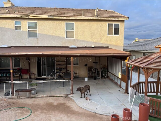 13023 Tehachapi St, Hesperia, CA 92344 - rear view of property featuring a patio area