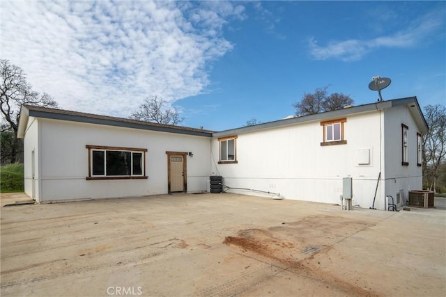 back of property with a patio