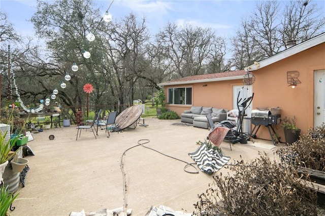 view of patio featuring a grill and outdoor lounge area